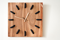 Hamba wall clock by Louw Roets